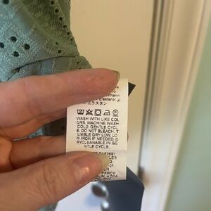 Embroided hollow-out look tunic.